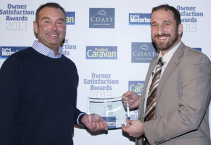 Scot Naylor receiving an award on behalf of Vantage Motorhomes Ltd.